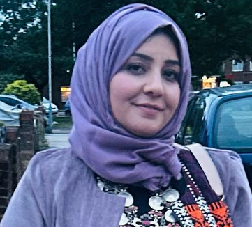 Lady wearing a headscarf smiling