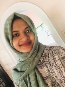 Lady wearing headscarf smiling